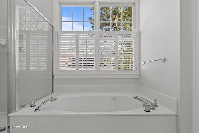 bathroom featuring a garden tub