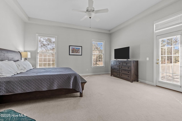 bedroom featuring baseboards, multiple windows, carpet flooring, and access to outside