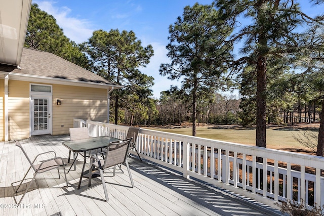 wooden terrace with outdoor dining area