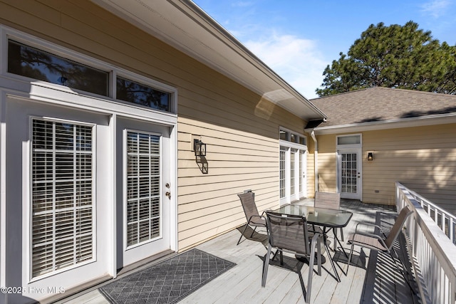 deck featuring outdoor dining area