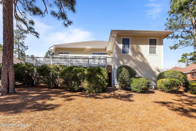 rear view of property with a deck