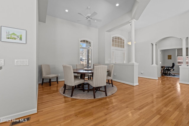 dining area featuring a wealth of natural light and ornate columns