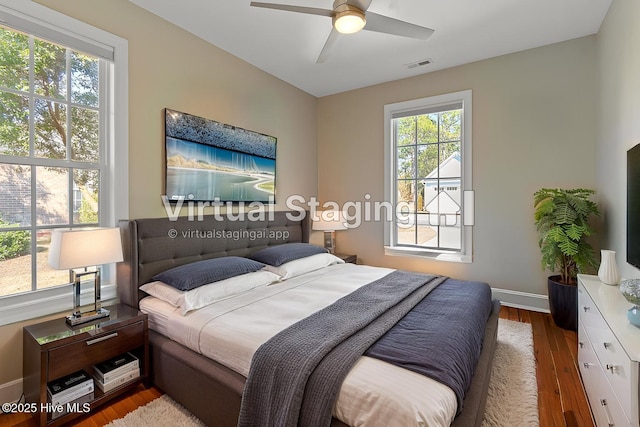 4155 Windham Ln, Southport, NC 28461 - bedroom with wood finished floors and a ceiling fan