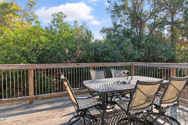 wooden deck with outdoor dining area