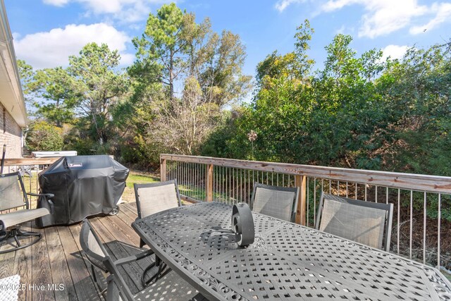 4155 Windham Ln, Southport, NC 28461 - wooden deck featuring outdoor dining area and area for grilling