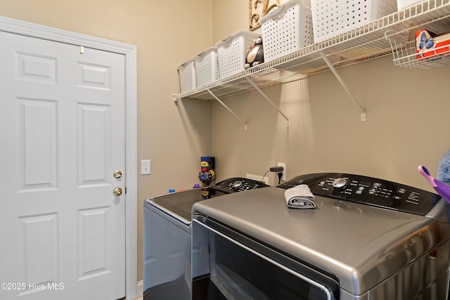 clothes washing area featuring laundry area and independent washer and dryer