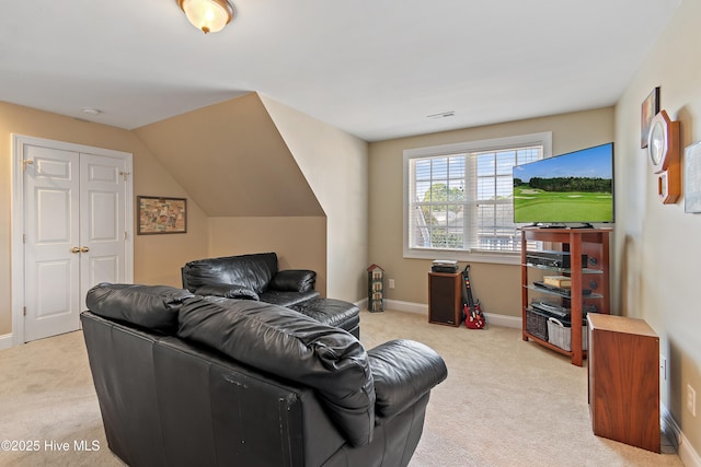 living area featuring carpet flooring, visible vents, and baseboards