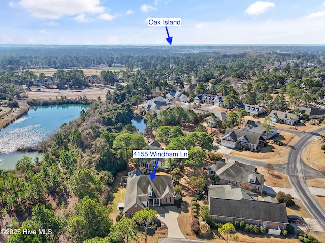 birds eye view of property featuring a water view and a residential view