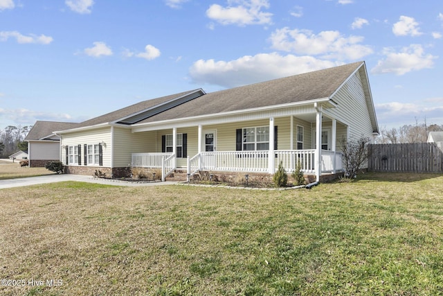 ranch-style house featuring a front lawn and a porch