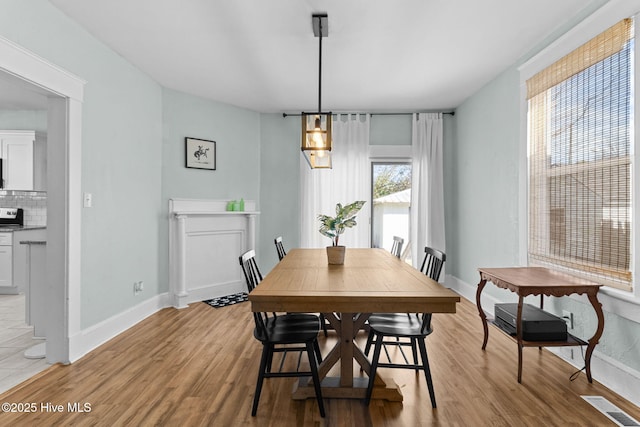 dining area with light hardwood / wood-style floors