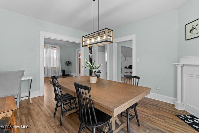 dining area with dark hardwood / wood-style floors