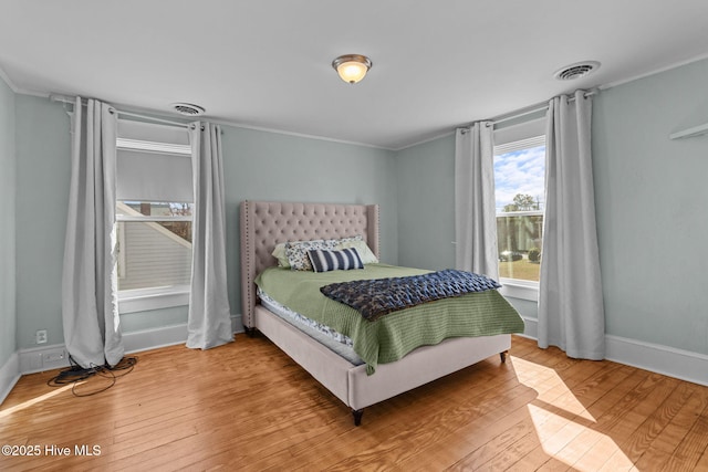 bedroom with hardwood / wood-style floors