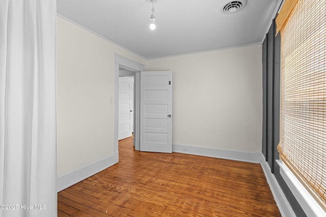 unfurnished room featuring hardwood / wood-style flooring