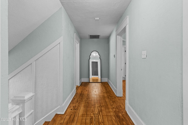 hallway featuring hardwood / wood-style floors