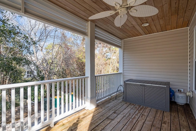 wooden deck featuring a ceiling fan