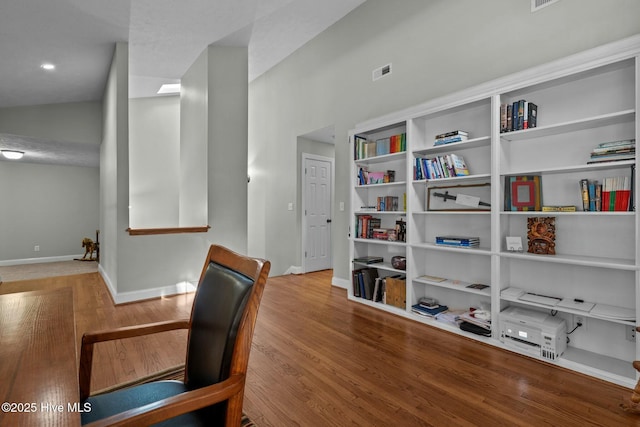 office featuring visible vents, baseboards, and wood finished floors