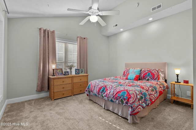 bedroom with light carpet, vaulted ceiling, visible vents, and baseboards