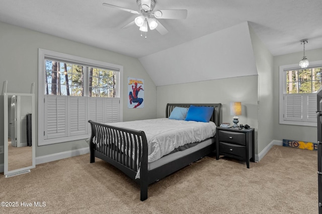 bedroom featuring lofted ceiling, light colored carpet, ceiling fan, and baseboards