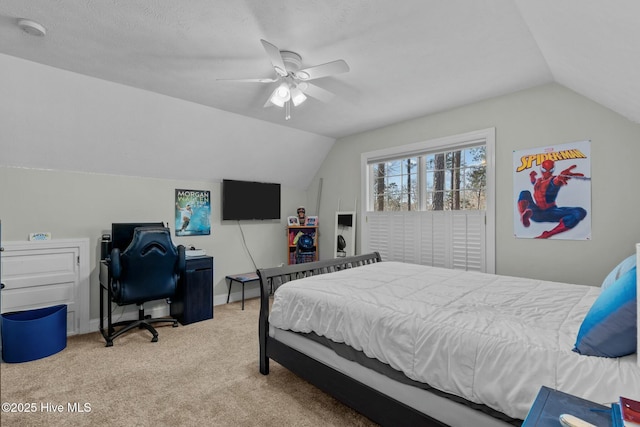 bedroom with vaulted ceiling, ceiling fan, light carpet, and baseboards