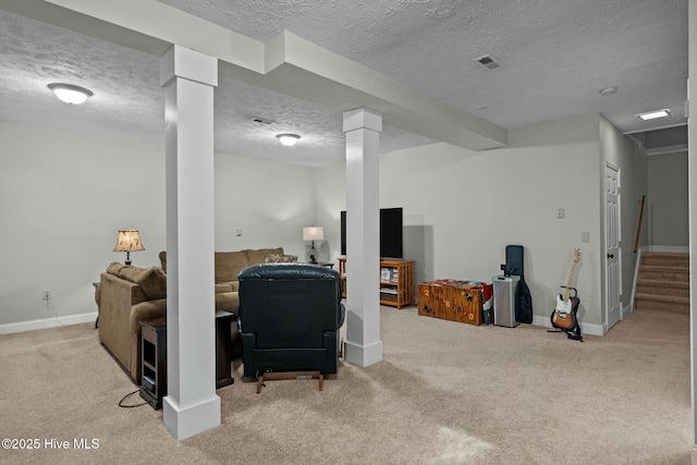 finished basement with a textured ceiling, light carpet, visible vents, baseboards, and stairs