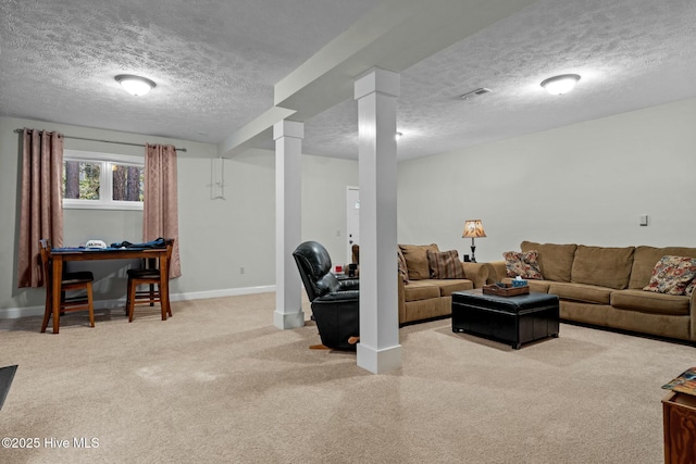 living area featuring light carpet, a textured ceiling, visible vents, and baseboards