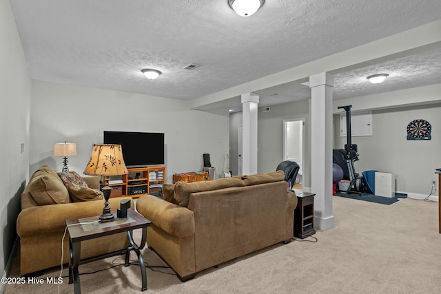 living room with light carpet, baseboards, visible vents, and a textured ceiling