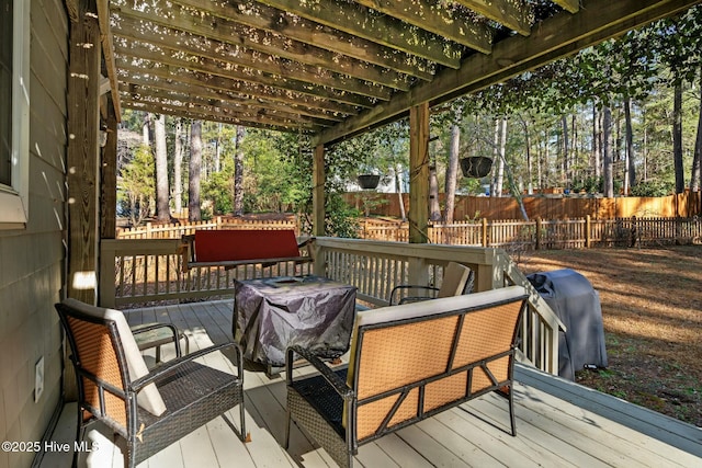 deck with a fenced backyard and a grill