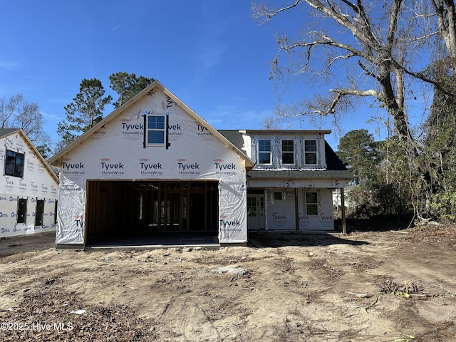 unfinished property with a garage