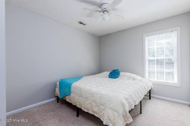 bedroom featuring carpet flooring, baseboards, and visible vents