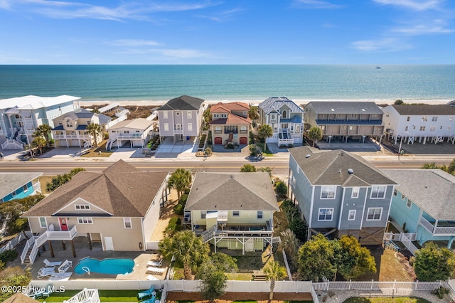 birds eye view of property with a water view and a residential view