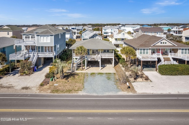 birds eye view of property with a residential view