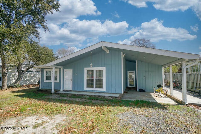 416 Trott St, Oak Island, NC 28465 - view of front facade featuring a patio area and board and batten siding