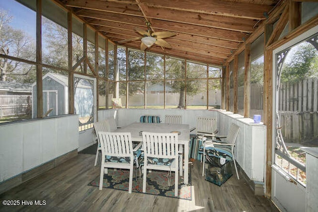 416 Trott St, Oak Island, NC 28465 - sunroom / solarium with outdoor dining area, a ceiling fan, healthy amount of natural light, and lofted ceiling