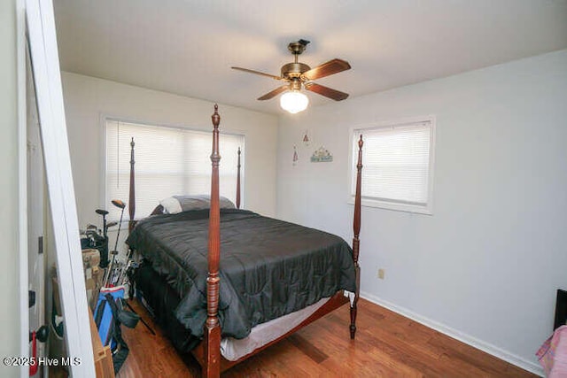 416 Trott St, Oak Island, NC 28465 - bedroom featuring wood finished floors and ceiling fan