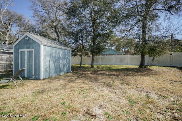416 Trott St, Oak Island, NC 28465 - fenced backyard with a storage unit