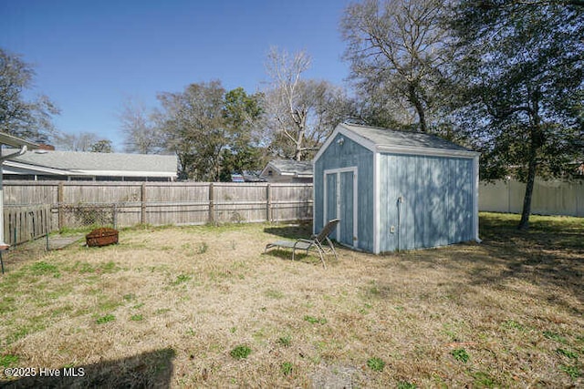 416 Trott St, Oak Island, NC 28465 - fenced backyard featuring a storage shed