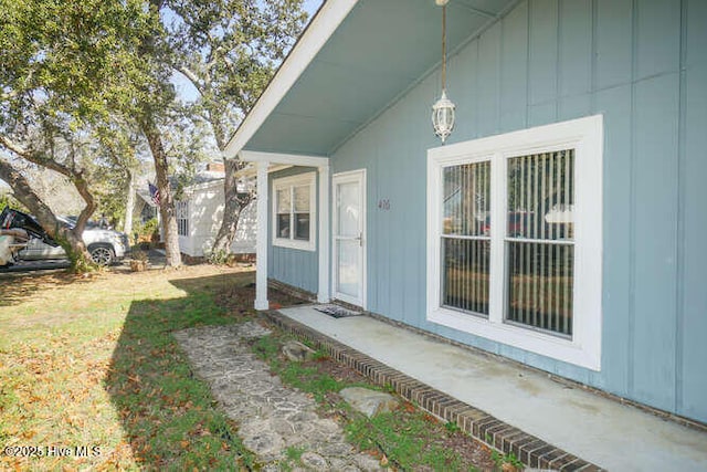 416 Trott St, Oak Island, NC 28465 - entrance to property featuring board and batten siding