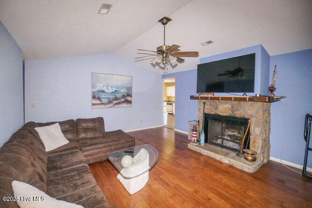 416 Trott St, Oak Island, NC 28465 - living area with lofted ceiling, wood finished floors, a ceiling fan, and a fireplace