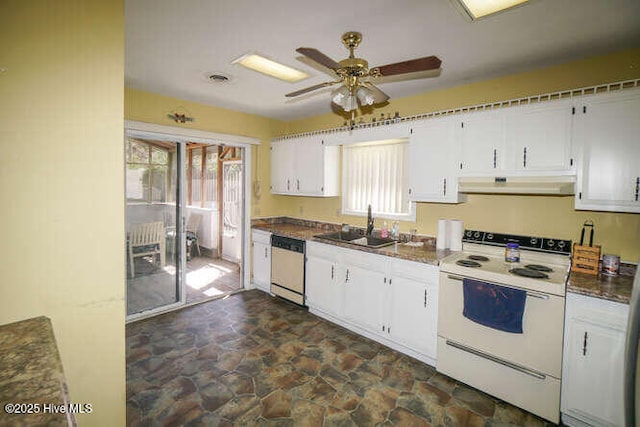 416 Trott St, Oak Island, NC 28465 - kitchen with white range with electric cooktop, under cabinet range hood, dishwasher, dark stone finish flooring, and healthy amount of natural light