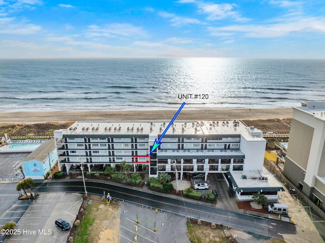 bird's eye view with a view of the beach and a water view