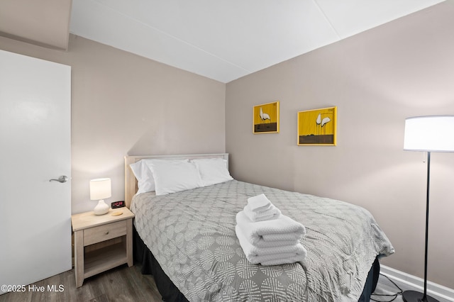 bedroom with wood finished floors