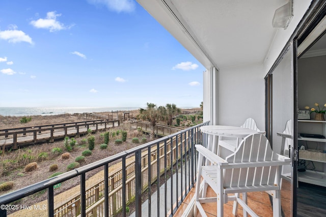 balcony with a view of the beach and a water view