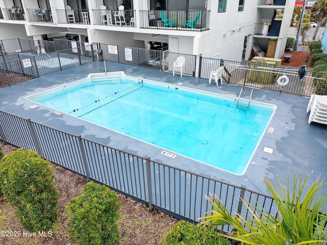 view of pool with fence