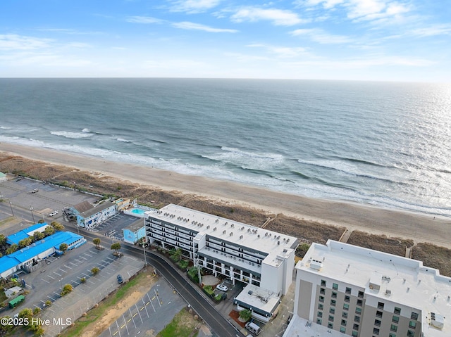 bird's eye view with a beach view and a water view