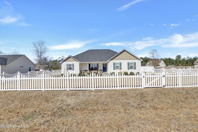 ranch-style house with a fenced front yard and a shingled roof