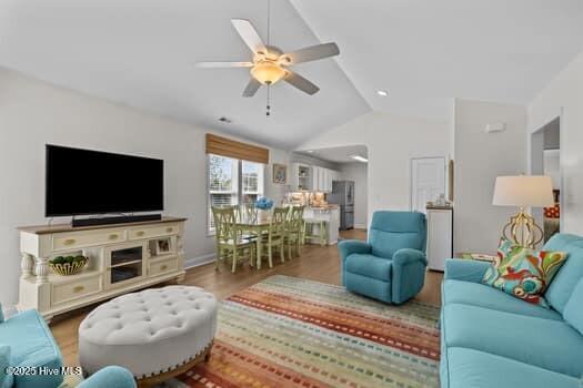 2011 Fisher St, Morehead City, NC 28557 - living area featuring vaulted ceiling, wood finished floors, and ceiling fan