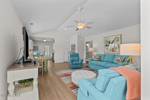 2011 Fisher St, Morehead City, NC 28557 - living room featuring vaulted ceiling, a ceiling fan, and wood finished floors