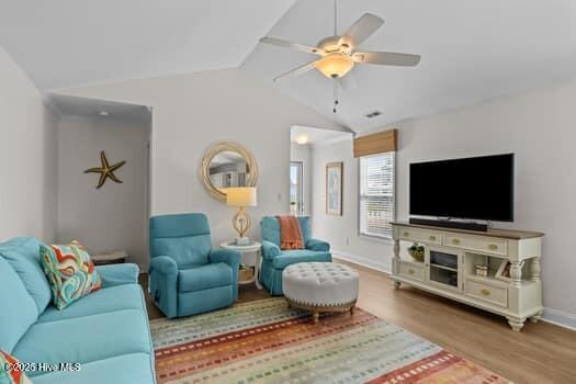 2011 Fisher St, Morehead City, NC 28557 - living room with wood finished floors, vaulted ceiling, and a ceiling fan