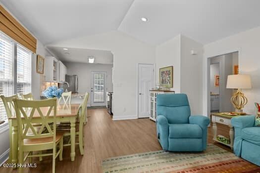 2011 Fisher St, Morehead City, NC 28557 - living room with wood finished floors and vaulted ceiling