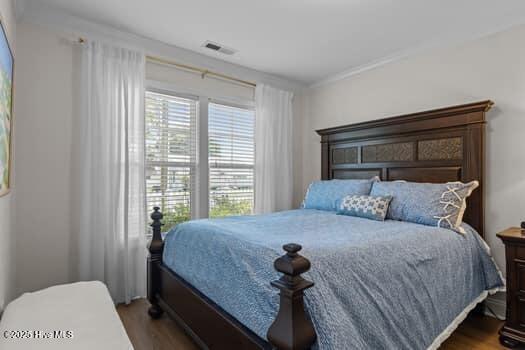 2011 Fisher St, Morehead City, NC 28557 - bedroom with wood finished floors and crown molding